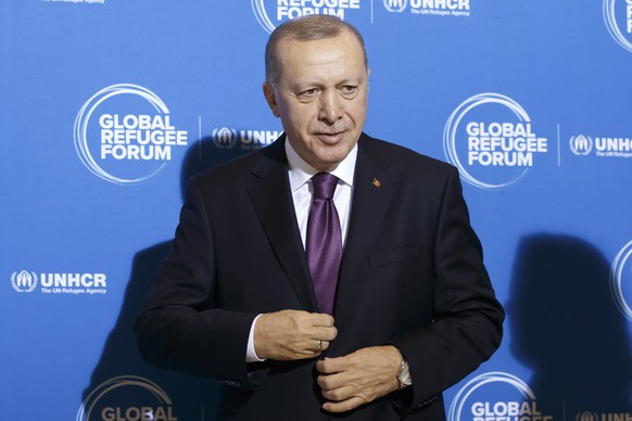 epa08076800 Turkey&#039;s President Recep Tayyip Erdogan arrives for the opening of the United Nations High Commissioner for Refugees (UNHCR) Global Refugee Forum at the European headquarters of the U ...