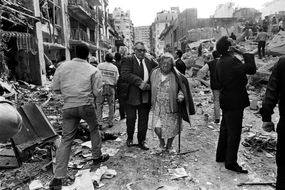 epa07656664 A handout photo made available by photojournalist Julio Menajovsky shows one of his pictures moments after the attack on the Jewish mutual AMIA in 1994, in Buenos Aires, Argentina. The pho ...