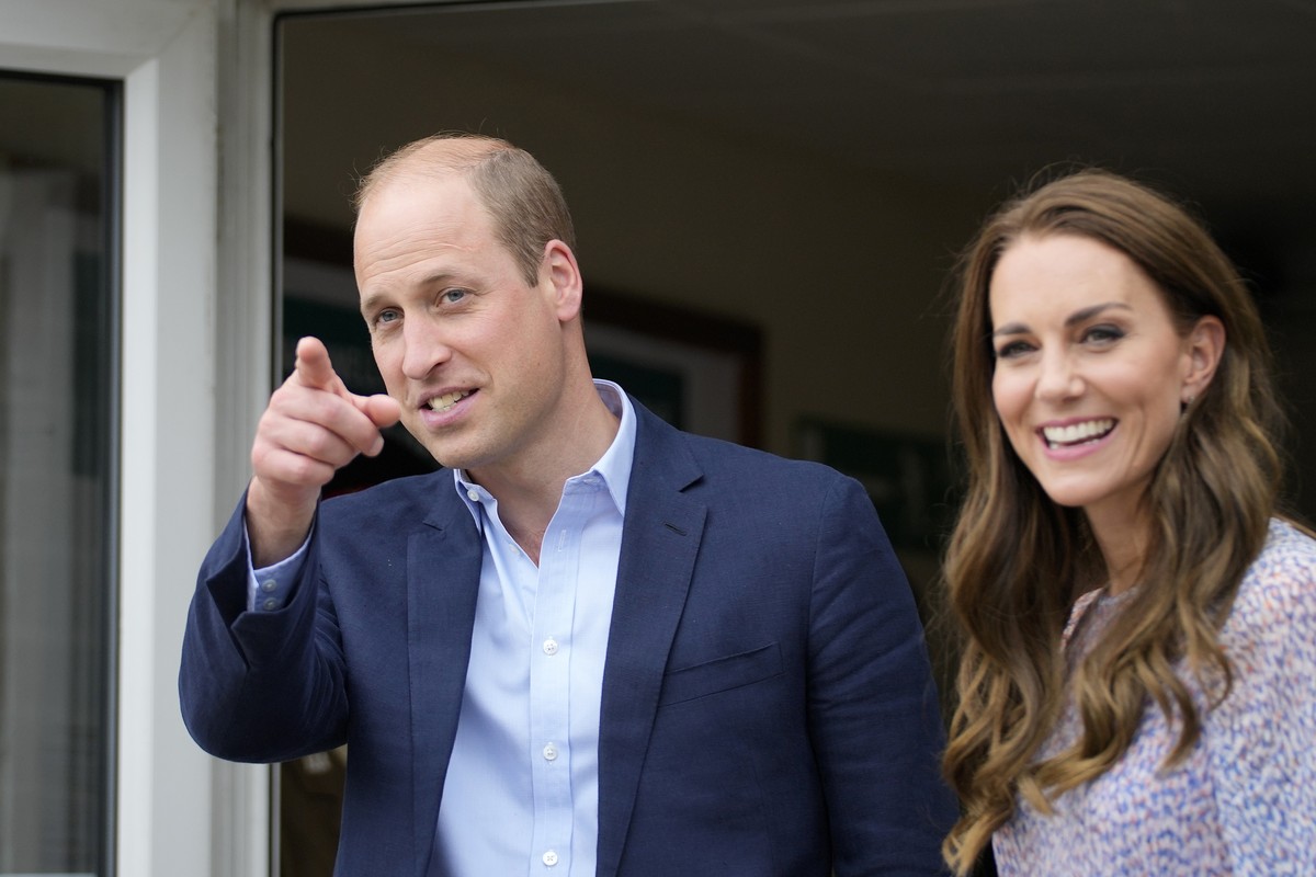 Britain's Prince William and Kate, the Duke and Duchess of Cambridge smile during a visit to housing charity Jimmy's in Cambridge, England, Thursday, June 23, 2022. The Duke and Duchess of C ...