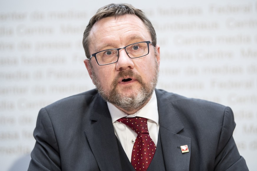 epa08898002 Christian Bock, Director Federal Customs Administration, speaks during a press conference about the travel restrictions, in Bern, Switzerland, 21 December 2020. Switzerland announced trave ...