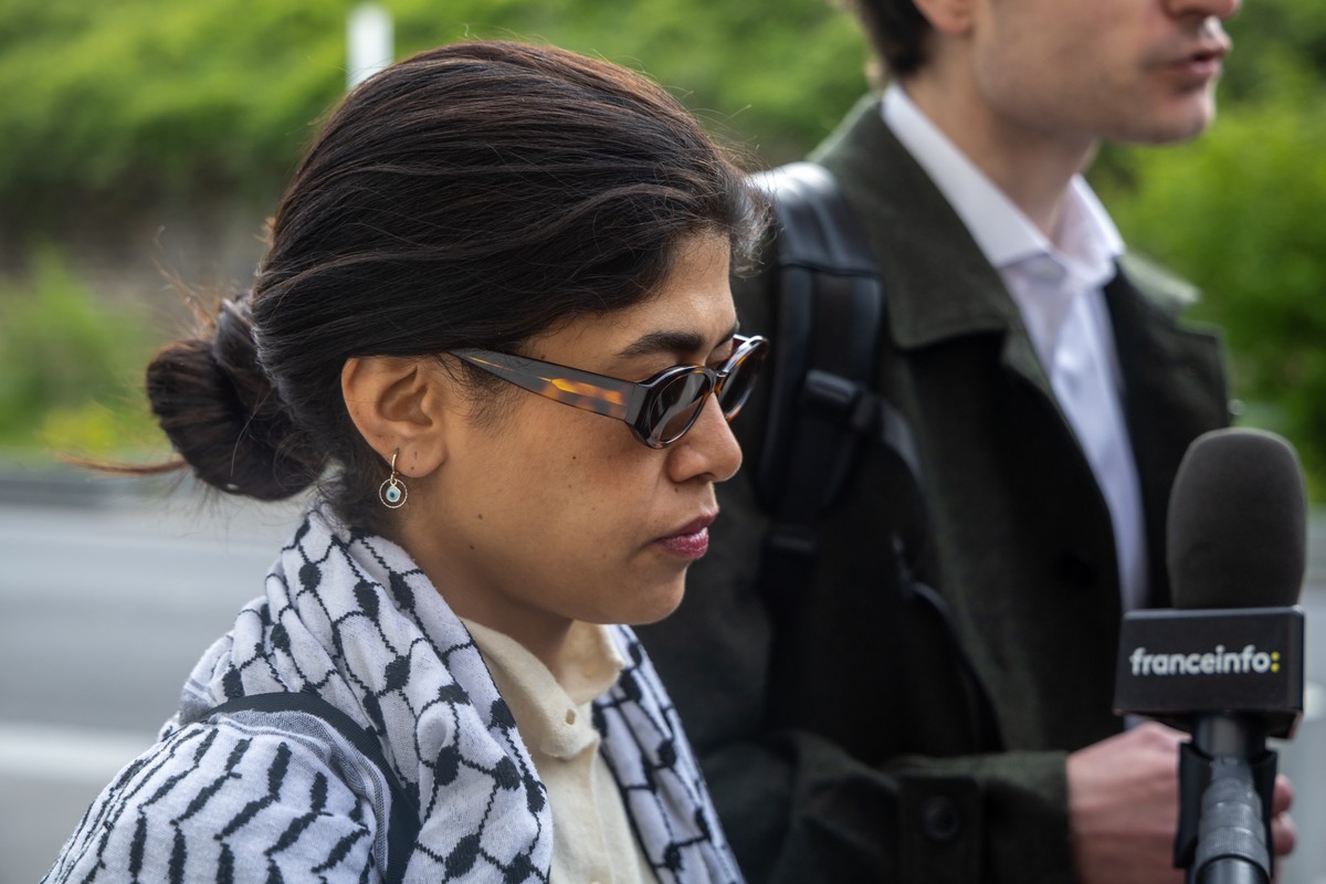 epa12867074 French MEP Rima Hassan arrives at the Paris Police Prefectures Criminal Investigation Department, where Hassan is due to be questioned for a second time on suspicion of glorifying terrori ...