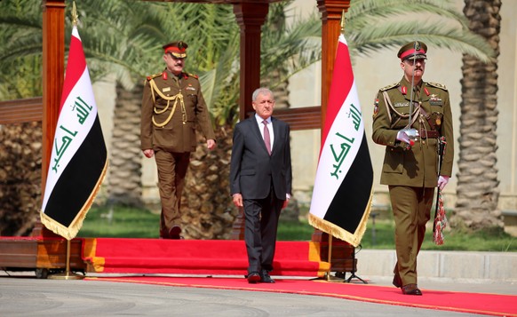 epa10248775 Newly-elected Iraqi President Abdul-Latif Rashid reviews the honor guard during a handover ceremony at the al-Salam presidential palace in Baghdad, Iraq, 17 October 2022. The Iraqi parliam ...