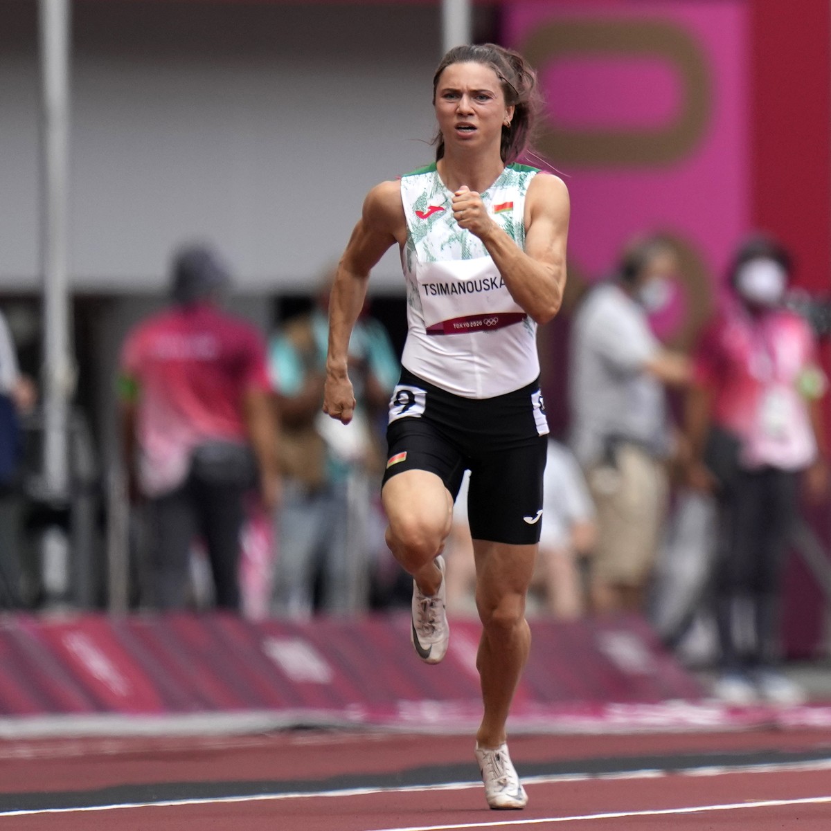 Krystsina Tsimanouskaya, of Belarus, runs in the women's 100-meter run at the 2020 Summer Olympics, Friday, July 30, 2021. Tsimanouskaya alleged her Olympic team tried to remove her from Japan in ...