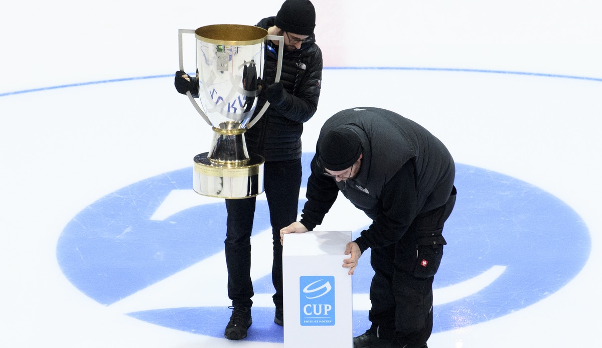 Technical staff members set up the Swiss Ice Hockey Cup Trophy before the Swiss Ice Hockey Cup final game between EHC Kloten and Geneve-Servette HC, at the SWISS Arena ice stadium, in Kloten, Wednesda ...