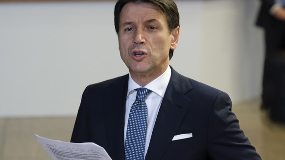 epa06849059 Italian Prime Minister Giseppe Conte speaks at the end of a night of negotiation on migration during an European Council summit in Brussels, Belgium, 29 June 2018. EU countries&#039; leade ...