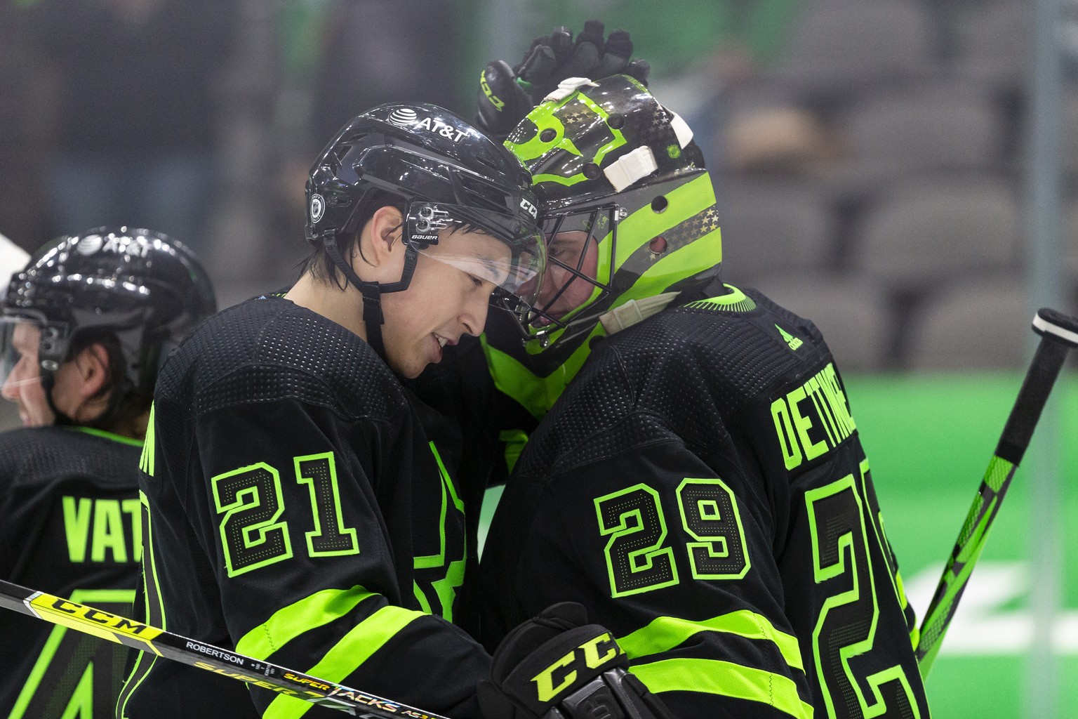 Dallas Stars goaltender Jake Oettinger (29) is congratulated by teammate Jason Robertson (21) after an NHL hockey game against the Columbus Blue Jackets, Saturday, April 17, 2021, in Dallas. Dallas wo ...
