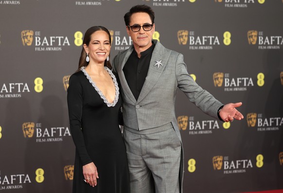 epa11163670 Susan Downey and Robert Downey Jr attend the 2024 EE BAFTA Film Awards at the Royal Festival Hall in London, Great Britain, February 18, 2024. The ceremony is hosted by the British Academy of Film…