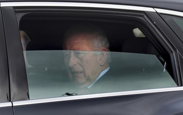 Britain&#039;s King Charles III is driven by car from Clarence House, his London home, along The Mall towards Buckingham Palace in London, Friday, March 28, 2025. (Yui Mok/PA via AP)
Britain Royals