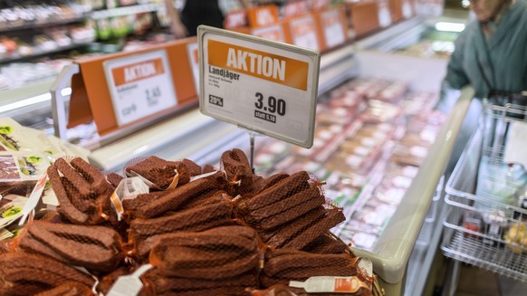 The Landjaeger sausage is on special offer (labeled with "Aktion"), pictured on March 5, 2013, at the Migros branch in Baden, Switzerland. Migros is Switzerland's the largest retail com ...