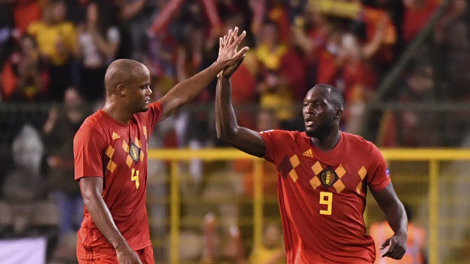 Belgium&#039;s Romelu Lukaku, right, celebrates with teammate Vincent Kompany after scoring his side&#039;s second goal during the UEFA Nations League soccer match between Belgium and Switzerland at t ...