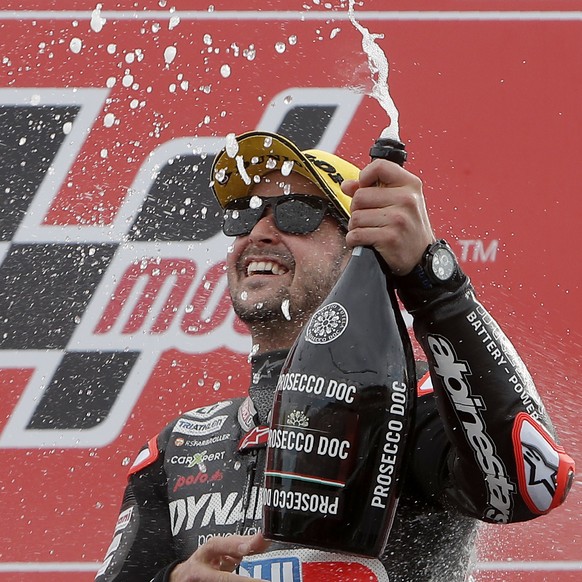 Moto2 rider Thomas Luthi of Switzerland celebrates on the podium after finishing second in the Valencia Motorcycle Grand Prix, the last race of the season, at the Ricardo Tormo circuit in Cheste, near ...