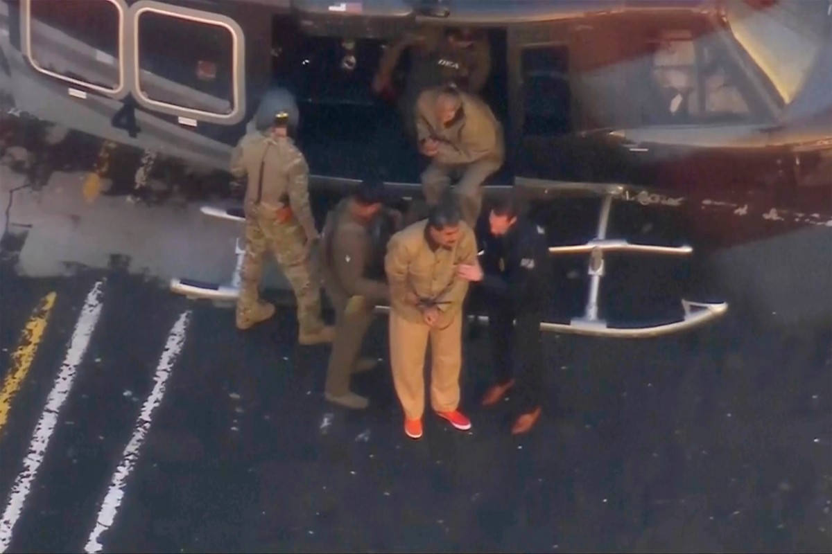 This image taken video shows Venezuelan President Nicolas Maduro getting off a helicopter on his way to Manhattan Federal Court, Monday, Jan. 5, 2026, in New York. (WABC via AP)
Venezuela US