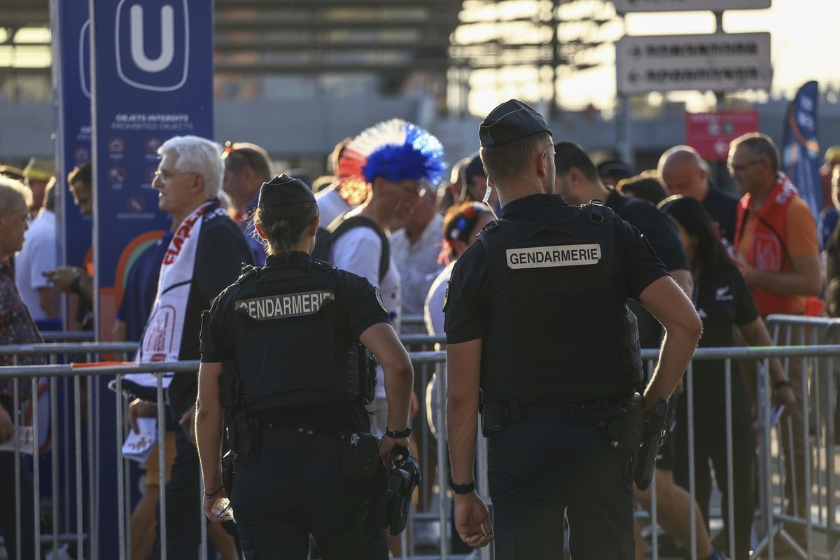 Police officers guard the Stade de France stadium prior the the Rugby World Cup Pool A match between France and New Zealand, in Saint Denis , north of Paris, Friday, Sept, 8, 2023. (AP Photo/Aurelien  ...