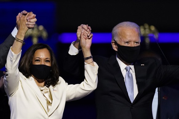 Vice President-elect Kamala Harris holds hands with President-elect Joe Biden and her husband Doug Emhoff as they celebrate Saturday, Nov. 7, 2020, in Wilmington, Del. (AP Photo/Andrew Harnik)
Joe Bid ...