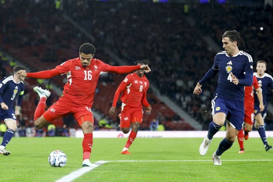 Switzerland's Zachary Athekame, left, fights for the ball against Scotland's Luis Binks, right, during the UEFA Nations League soccer match between Scotland and Switzerland at the Hampden Pa ...