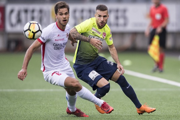 Thuns Dejan Sorgic, rechts, im Duell mit Sions Paulo Ricardo im Fussball Meisterschaftsspiel der Super League zwischen dem FC Thun und dem Sion, am Samstag, 19.Mai 2018, in der Stockhorn Arena in Thun ...