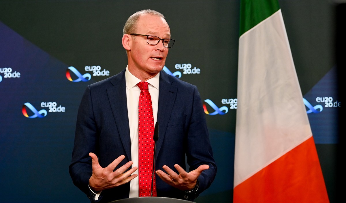 epa08877441 Ireland's Foreign Minister Simon Coveney speaks at a news conference following a meeting with German Foreign Minister Heiko Maas in Berlin, Germany, 11 December 2020. Ireland will tak ...