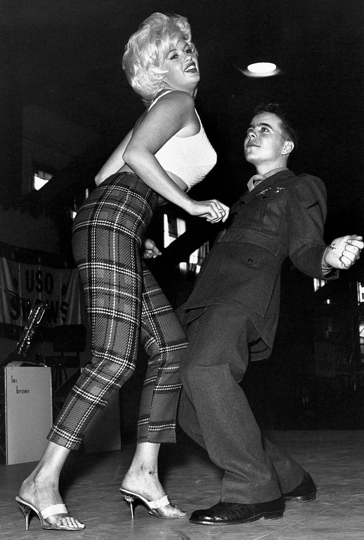 Marine Pfc. Bob Kamineki dances the twist with motion picture actress Jayne Mansfield at the U.S. Naval Station Argentia in Newfoundland, Canada. Mansfield traveled to the Arctic base with other Holly ...