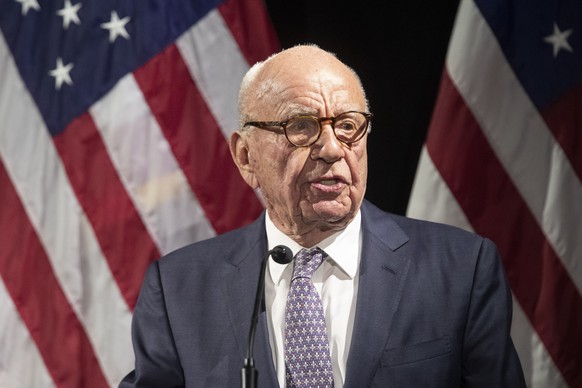 FILE - Rupert Murdoch introduces Secretary of State Mike Pompeo during the Herman Kahn Award Gala, in New York, Oct. 30, 2018. A voting technology company suing Fox News is arguing that Fox Corp. lead ...