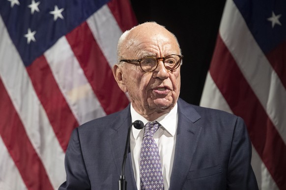 FILE – Rupert Murdoch introduces Secretary of State Mike Pompeo at the Herman Kahn Award Gala in New York, Oct. 30, 2018. A voice technology company suing Fox News alleges Fox Corp.  pipe...