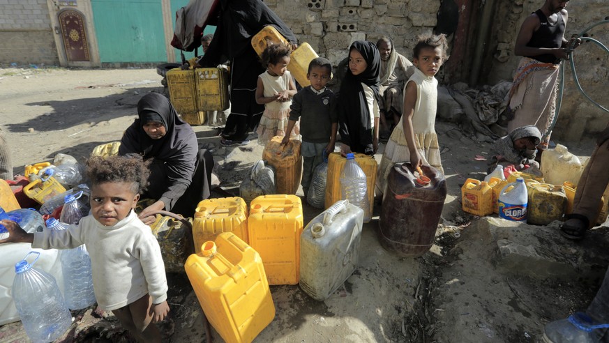 epa10537102 People collect drinking water from a donated tank on World Water Day, in Sana'a, Yemen, March 22, 2023. World Water Day is celebrated annually on March 22 to highlight the importance of…