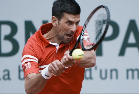 Serbia&#039;s Novak Djokovic plays a return to Lithuania&#039;s Ricardas Berankis during their third round match on day 7, of the French Open tennis tournament at Roland Garros in Paris, France, Satur ...