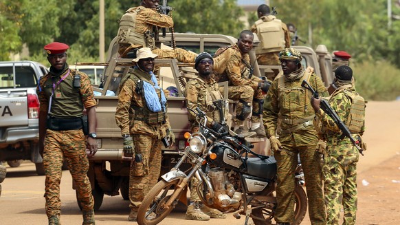 FILE - Soldiers, loyal to Burkina Faso&#039;s latest coup leader Capt. Ibrahim Traore, are pictured in Ouagadougou, Burkina Faso, Friday Oct. 14, 2022. Top human rights groups have released new report ...