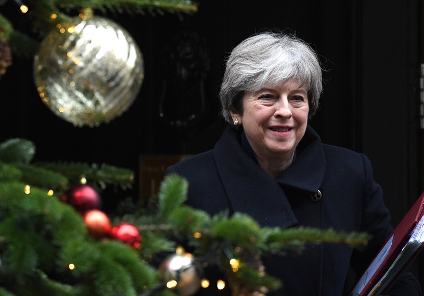 epa06387047 Britain&#039;s Prime Minister, Theresa May leaves number 10 Downing Street to attend Prime Minister&#039;s Questions in the Houses of Parliament in London, Britain, 13 December 2017. EPA/F ...