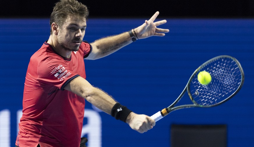 Switzerland&#039;s Stan Wawrinka returns a ball to Uruguay&#039;s Pablo Cuevas during their first round match at the Swiss Indoors tennis tournament at the St. Jakobshalle in Basel, Switzerland, on We ...