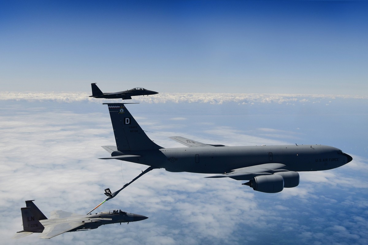 A KC-135 Stratotanker assigned to the 100th Air Refueling Wing conducts aerial operations with F-15 aircraft assigned to the 48th Fighter Wing in support of exercise Point Blank 20-02 over the North S ...