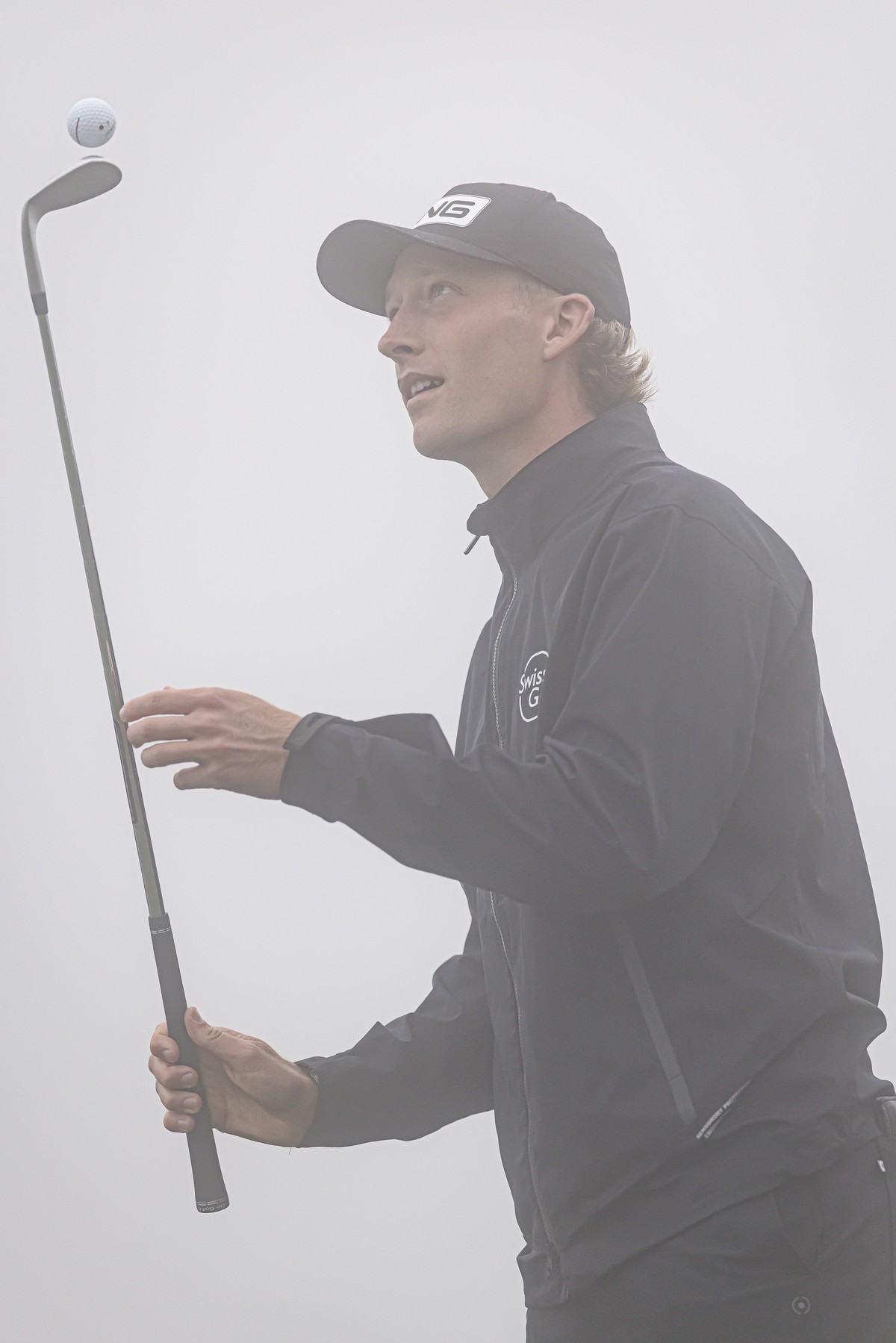 Roman Kleu of Switzerland waits as the tournament is suspended due to fog, during the first round of the DP World Tour Omega European Masters Golf Tournament, in Crans-Montana, Switzerland, Thursday,  ...