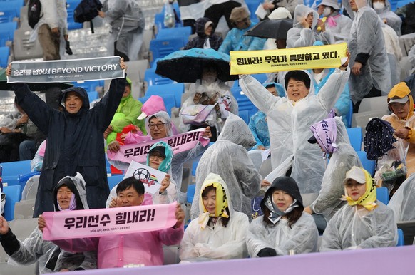 South and North Korean joint cheering squads react during the AFC Women's Champions League semifinal between North Korea's Naegohyang Women's FC and South Korea's Suwon FC in Suwon ...