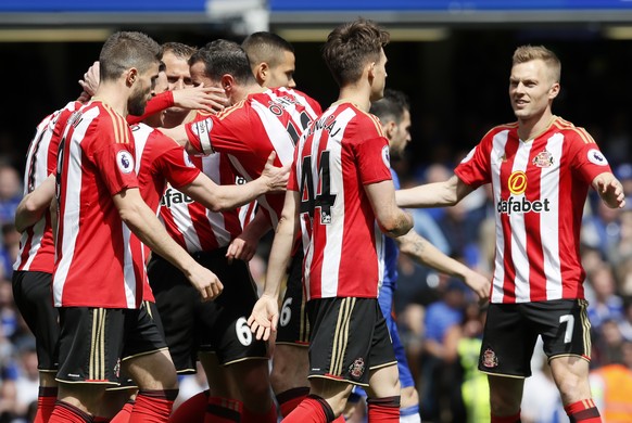 FILE - Sunderland players celebrate after scoring the opening goal during the English Premier League soccer match between Chelsea and Sunderland at Stamford Bridge stadium in London, Sunday, May 21, 2 ...