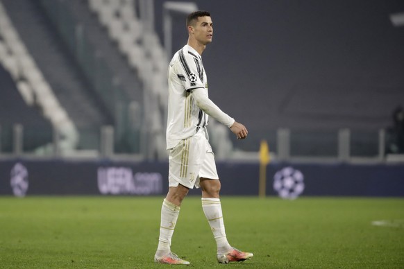 Juventus&#039; Cristiano Ronaldo walks on the pitch at the end of the Champions League, round of 16, second leg, soccer match between Juventus and Porto in Turin, Italy, Tuesday, March 9, 2021. Juvent ...