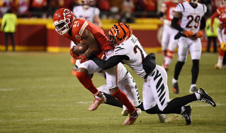 epa10439525 Kansas City Chiefs Marquez Valdes-Scantling (L) is tackled by Cincinnati Bengals Vonn Bell (R) in the second half of the AFC Championship game at GEHA Field at Arrowhead Stadium in Kansas  ...