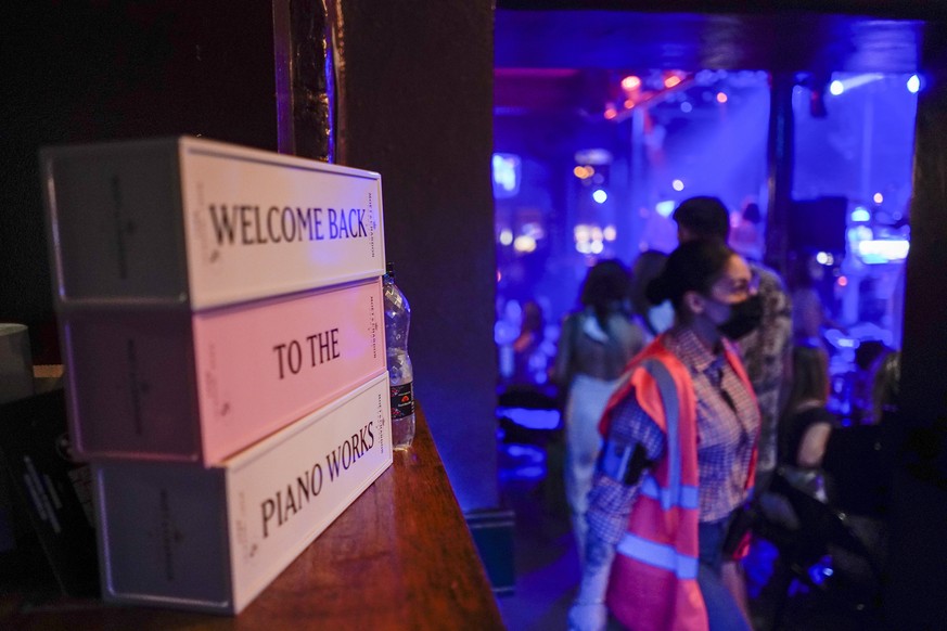 A message is displayed at the entrance of The Piano Works in Farringdon, in London, Monday, July 19, 2021. Thousands of young people plan to dance the night away at &#039;Freedom Day&#039; parties aft ...