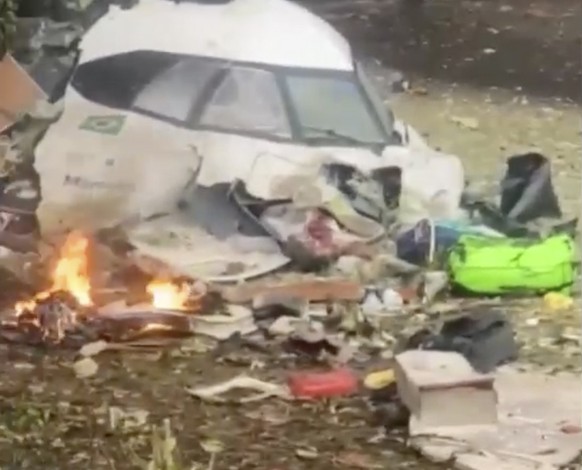This frame grab from video shows wreckage from a plane that crashed by a home in Vinhedo, Sao Paulo state, Brazil, Friday, Aug. 9, 2024. (Felipe Magalhaes Filho via AP)