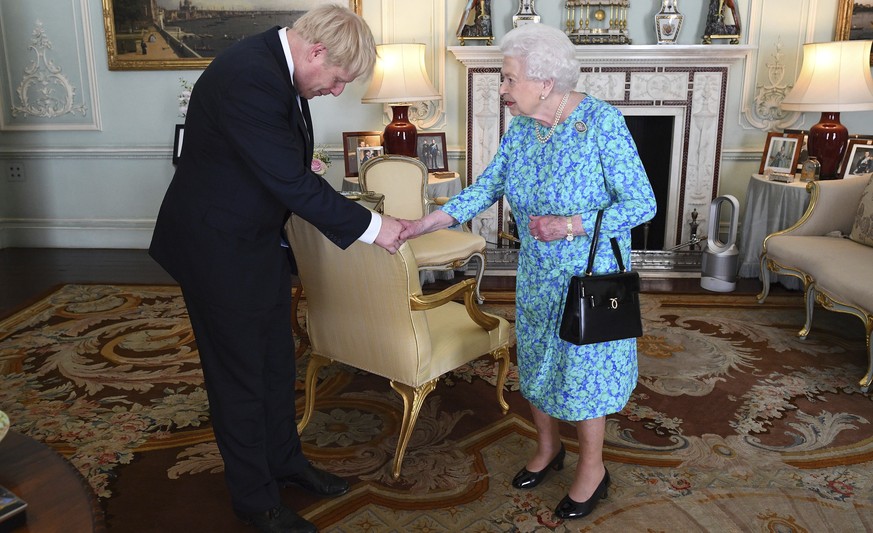 Britain&#039;s Queen Elizabeth II welcomes newly elected leader of the Conservative party Boris Johnson during an audience at Buckingham Palace, London, Wednesday July 24, 2019, where she invited him  ...