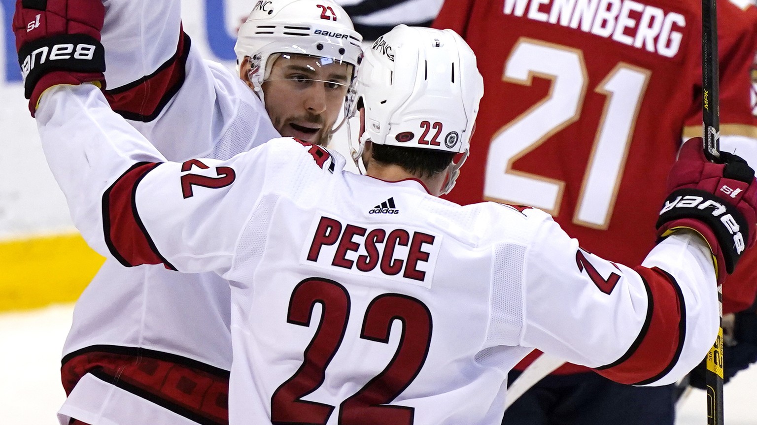 Carolina Hurricanes right wing Nino Niederreiter and defenseman Brett Pesce (22) celebrate after Niederreiter scored a goal during the second period of the team&#039;s NHL hockey game against the Flor ...