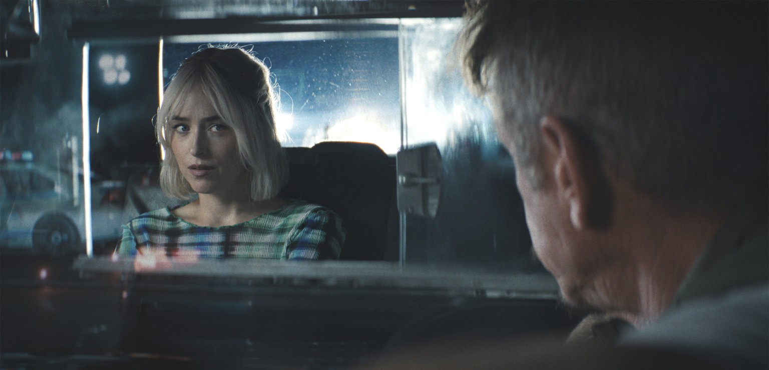 This image released by Sony Pictures Classics shows Dakota Johnson, left, and Sean Penn in a scene from &quot;Daddio.&quot; (Sony Pictures Classics via AP)