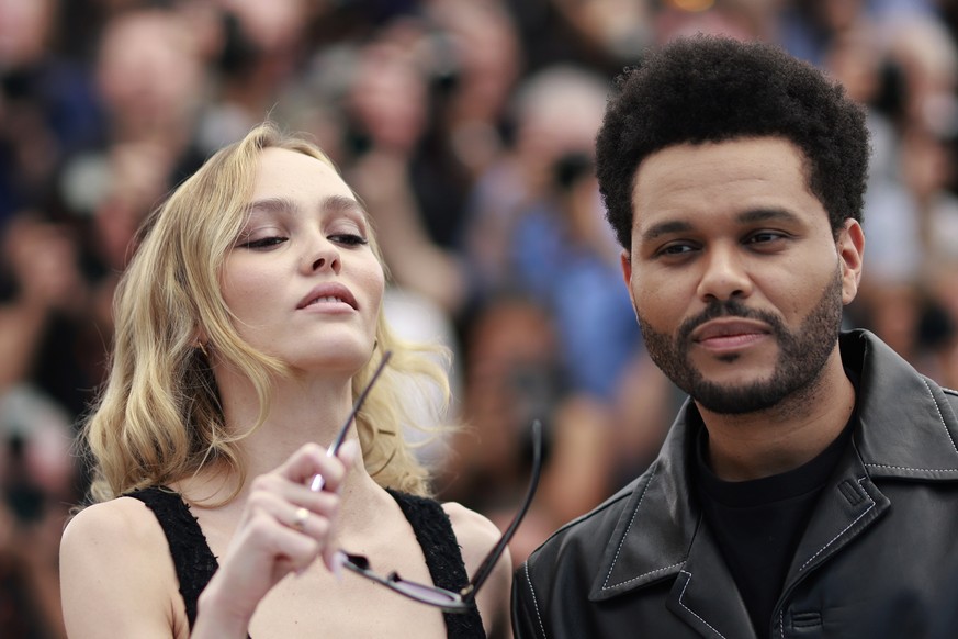epa10647656 French-American actor Lily-Rose Depp (L) and Canadian singer-songwriter and actor Abel Tesfaye aka The Weeknd attend the photocall for &#039;The Idol&#039; during the 76th annual Cannes Fi ...