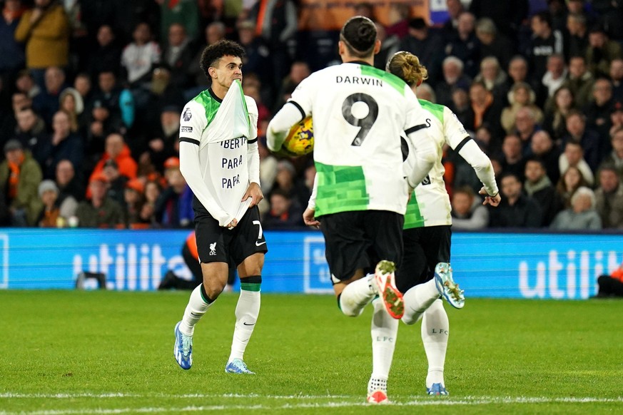 Luton Town v Liverpool - Premier League - Kenilworth Road Liverpool s Luis Diaz left celebrates scoring their side s first goal of the game by unveiling a shirt that reads translated to English Freedo ...