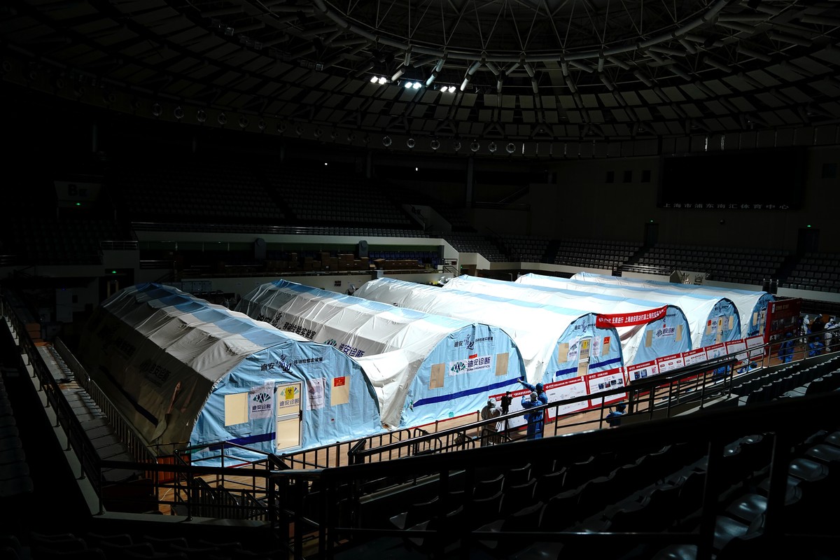 In this photo released by China's Xinhua News Agency, a temporary COVID-19 testing lab is seen in an arena in Shanghai, China, Friday, April 15, 2022. Anti-virus controls that have shut down some ...