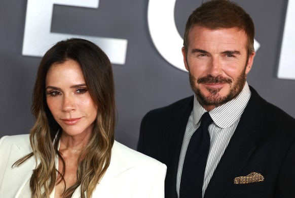 epa12440460 British fashion designer and singer Victoria Beckham (R) and her husband, former footballer David Beckham (L) attend the world premiere of the documentary series &#039;Victoria Beckham&#03 ...