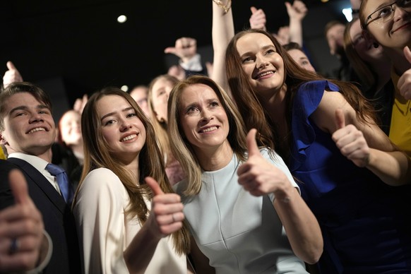 Members of the Reform Party and supporters of Prime Minister Kaja Kallas, centre, pose for photo in Tallinn, Estonia, Sunday, March 5, 2023. Voters in Estonia cast ballots Sunday in a parliamentary el ...