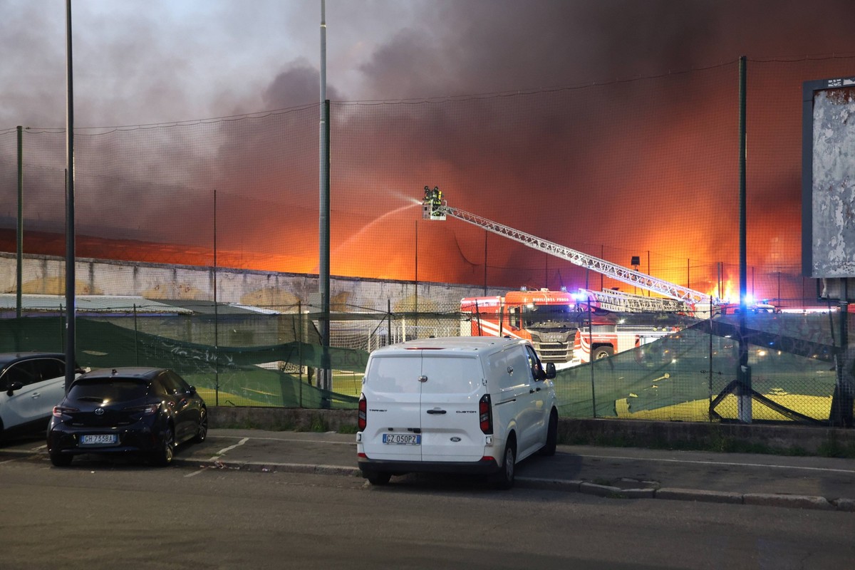 Fire broke out at a shipping company s warehouse in Milan MILAN, ITALY - JULY 8: Firefighters work to extinguish the blaze a fire breaks out at the 8,000-square-meter warehouse of an international shi ...
