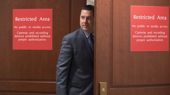 House Intelligence Committee Chairman Devin Nunes, R-Calif., returns to a secure area in the Capitol where his panel is interviewing former White House chief strategist Steve Bannon as part of its ong ...
