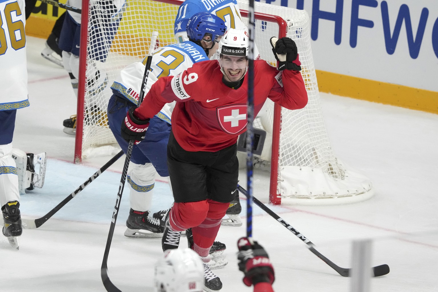 Damien Riat of Switzerland,celebrates a goal during the group B match between Switzerland and Kazakhstan at the ice hockey world championship in Riga, Latvia, Tuesday, May 16, 2023. (AP Photo/Roman Ko ...