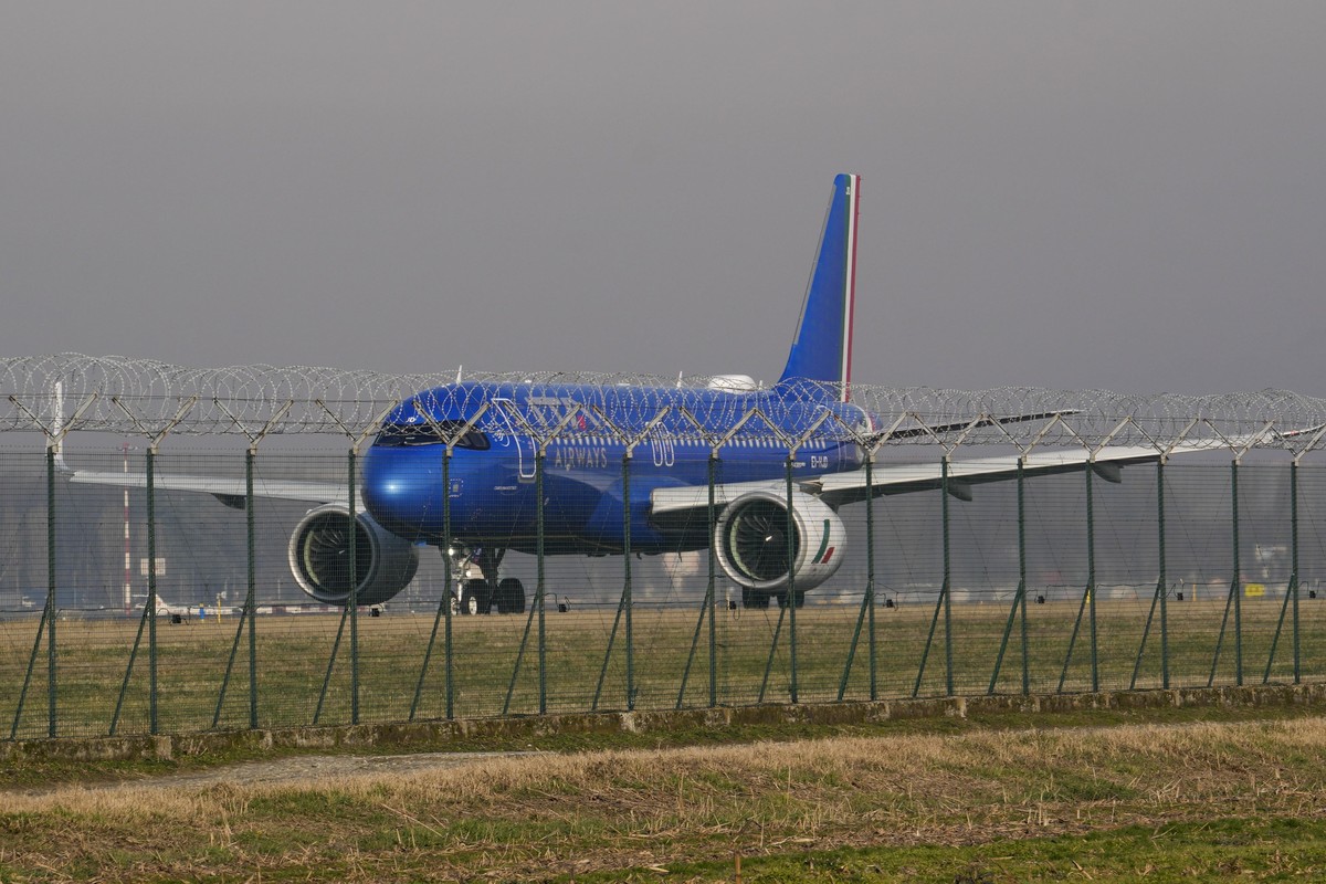 An ITA aircraft stands by on the tarmac before taking off from Linate airport, in Milan, Italy, Wednesday, Jan. 24, 2024. The European Commission on Tuesday announced an in-depth investigation of Germ ...