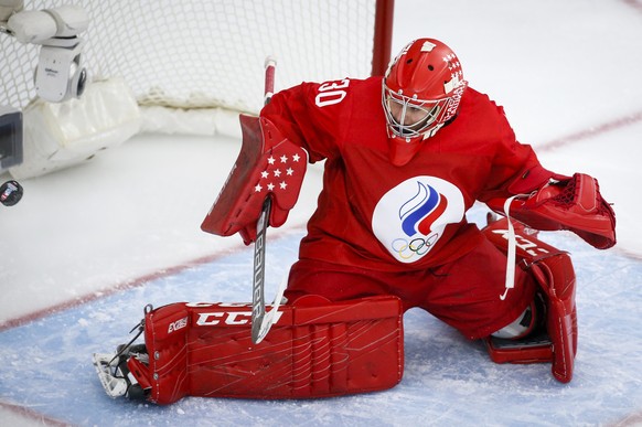 Russian Olympic Committee goalie Valeria Merkusheva deflects a shot against Switzerland during the second period of an IIHF womenÄôs world hockey championships game, in Calgary, Alberta, Saturday, Au ...